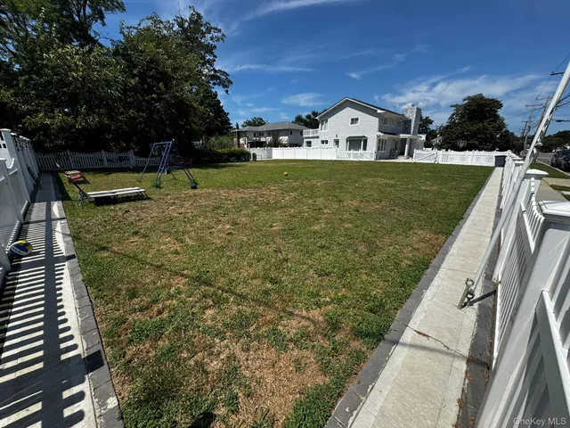 a view of swimming pool with a garden and trees