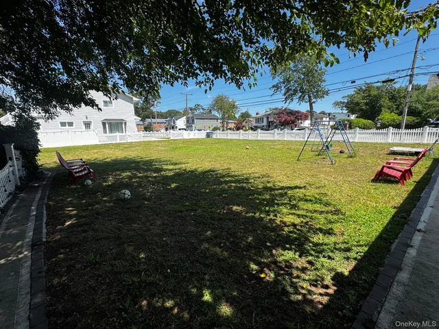 a view of swimming pool with a garden and trees