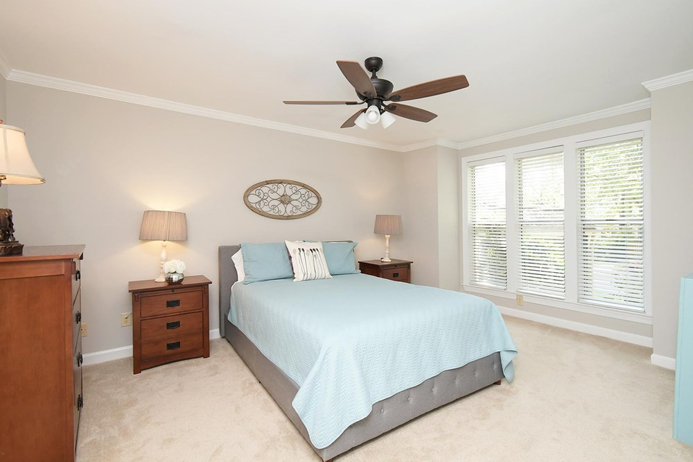 5903 Sentinel Drive Raleigh, NC 27609 - Photo 12 of 26 First Floor Master Bedroom with tall triple windows for natural light. Master Bedroom