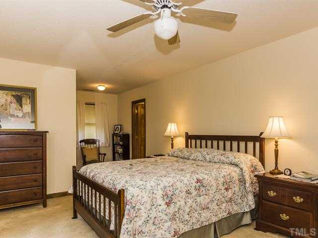 3508 Campbell Road Raleigh, NC 27606 - Photo 17 of 23 Spacious room with ceiling fan and walk in closet