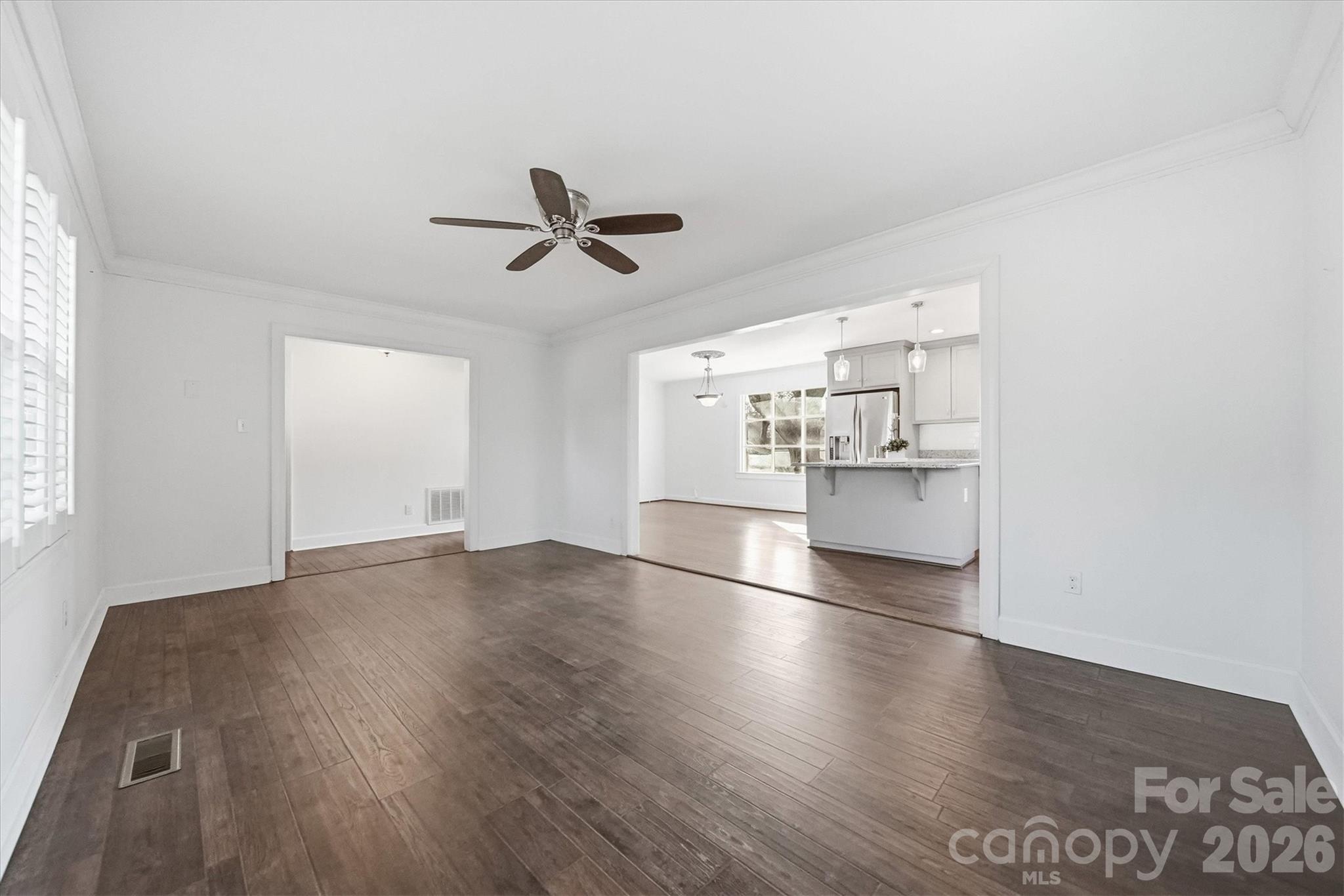 1215 6th Street Northwest Hickory, NC 28601 - Photo 18 of 48 a view of empty room with wooden floor and windows