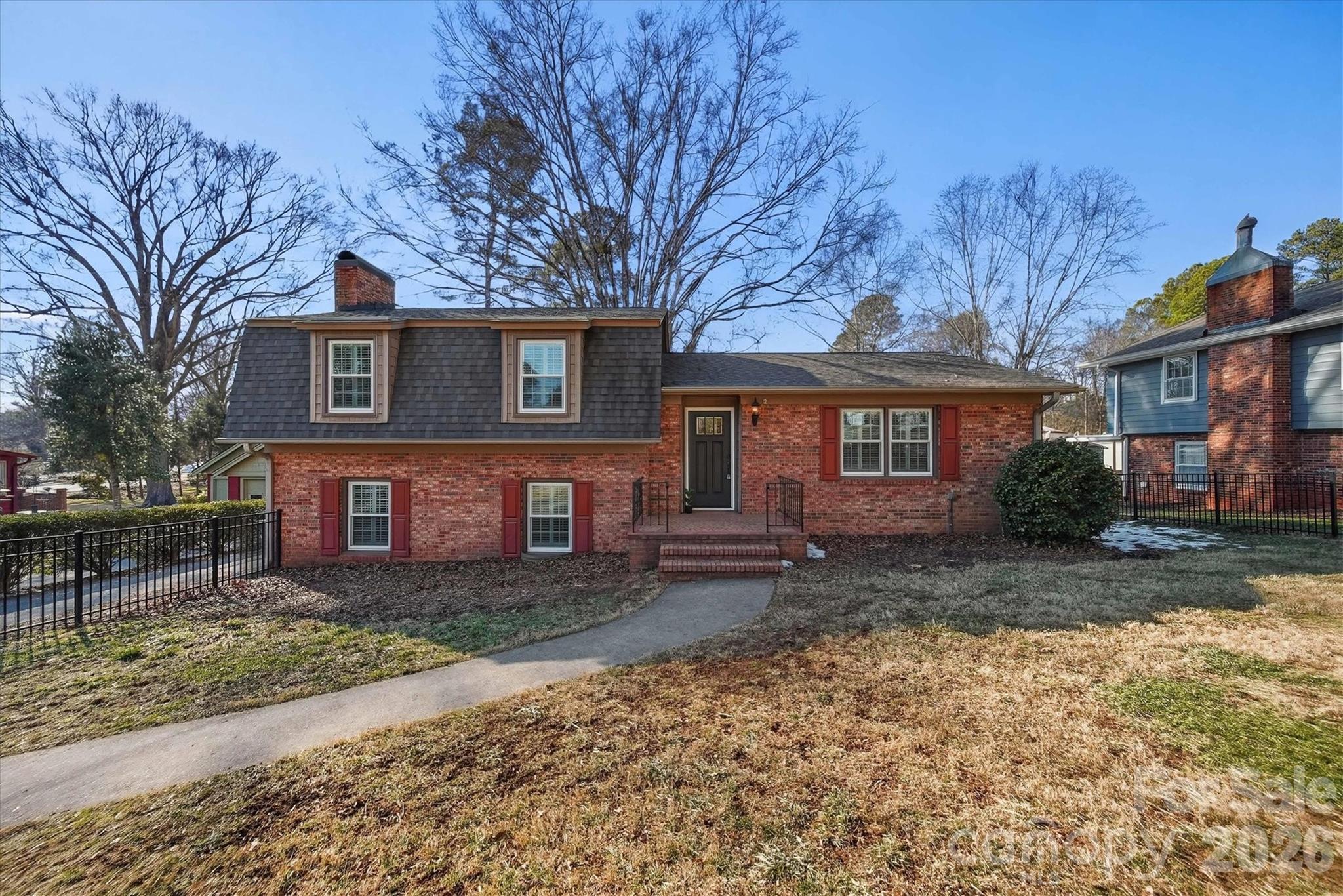 1215 6th Street Northwest Hickory, NC 28601 - Photo 2 of 48 a front view of a house with a yard and garage