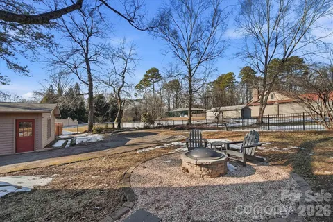 a view of a backyard with sitting area