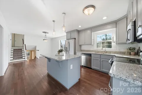 a view of a yard with large trees