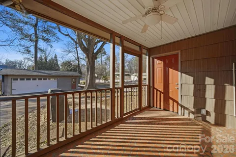 a view of a kitchen with stove and wooden floor