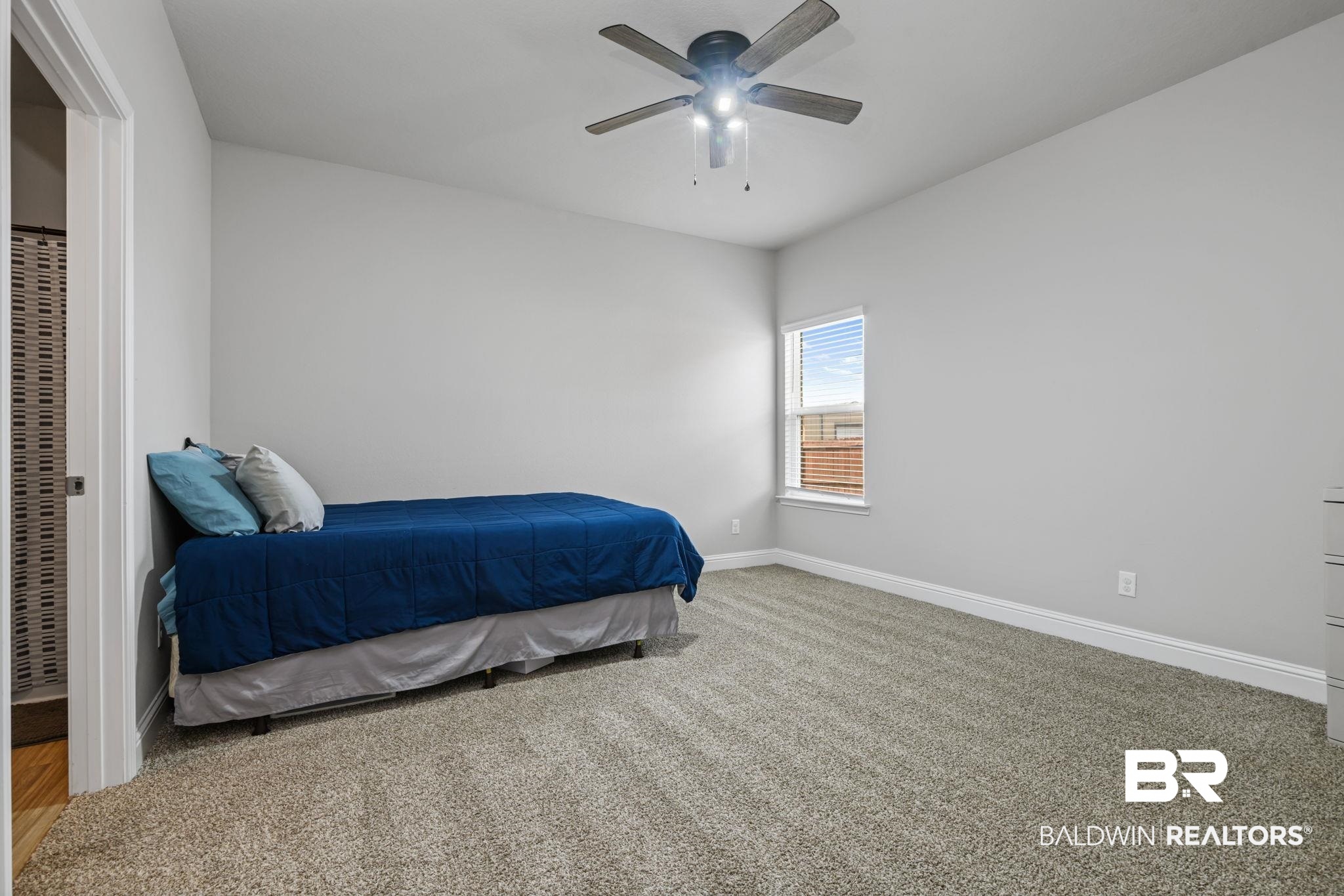 2183 Meadowview Loop Semmes, AL 36575 - Photo 26 of 58 Bedroom with light carpet and ceiling fan