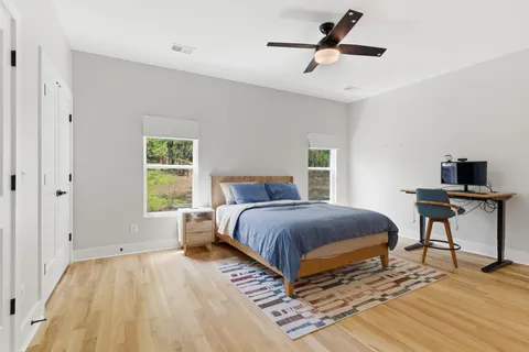 a bedroom with a bed and a table