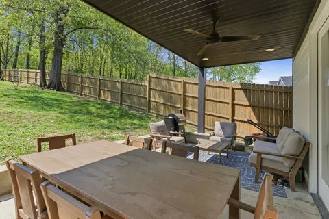 a view of a patio with a table chairs and a table