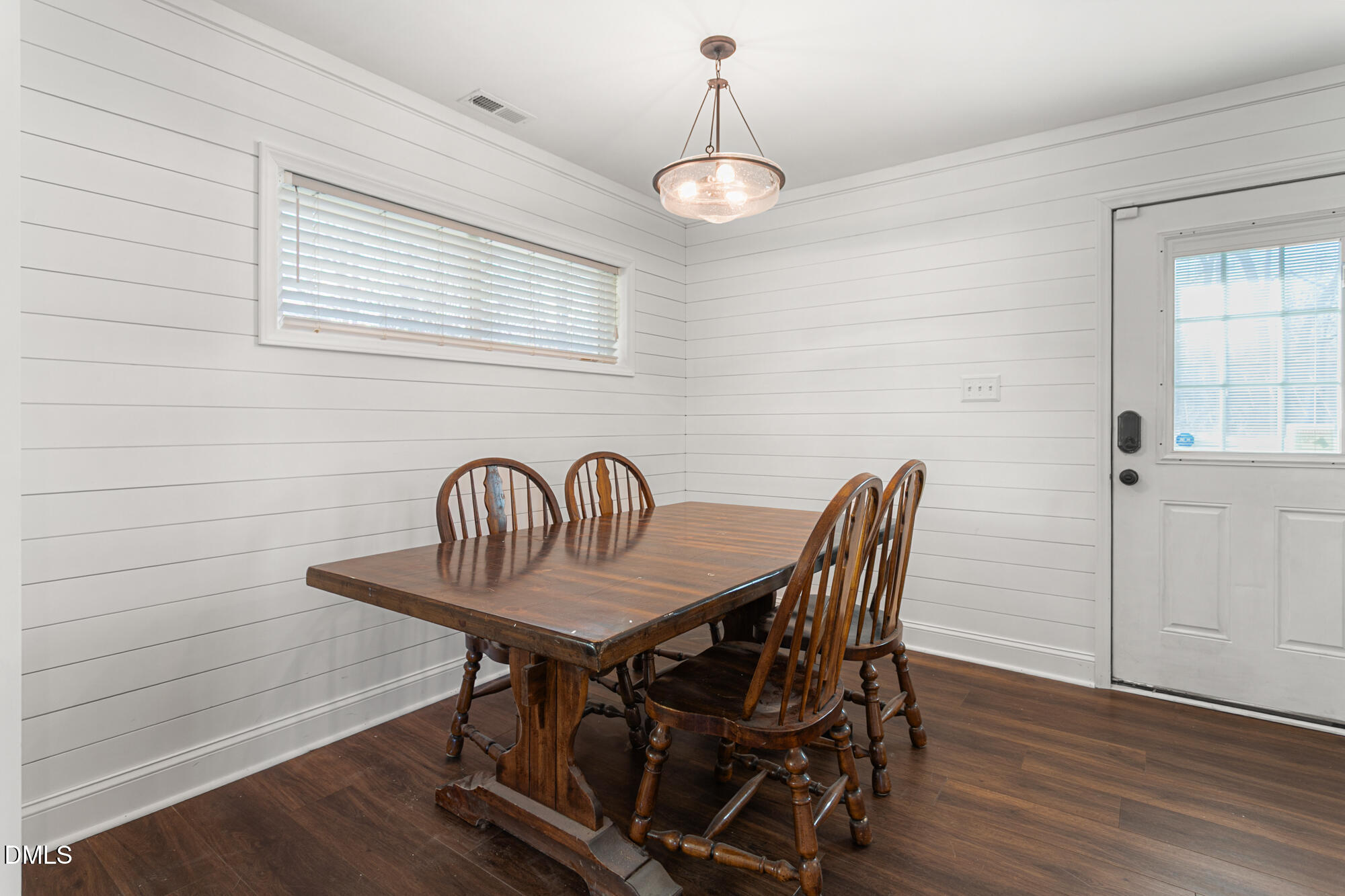 4244 Alamance Church Road Liberty, NC 27298 - Photo 11 of 37 a view of a dining room with furniture wooden floor and chandelier