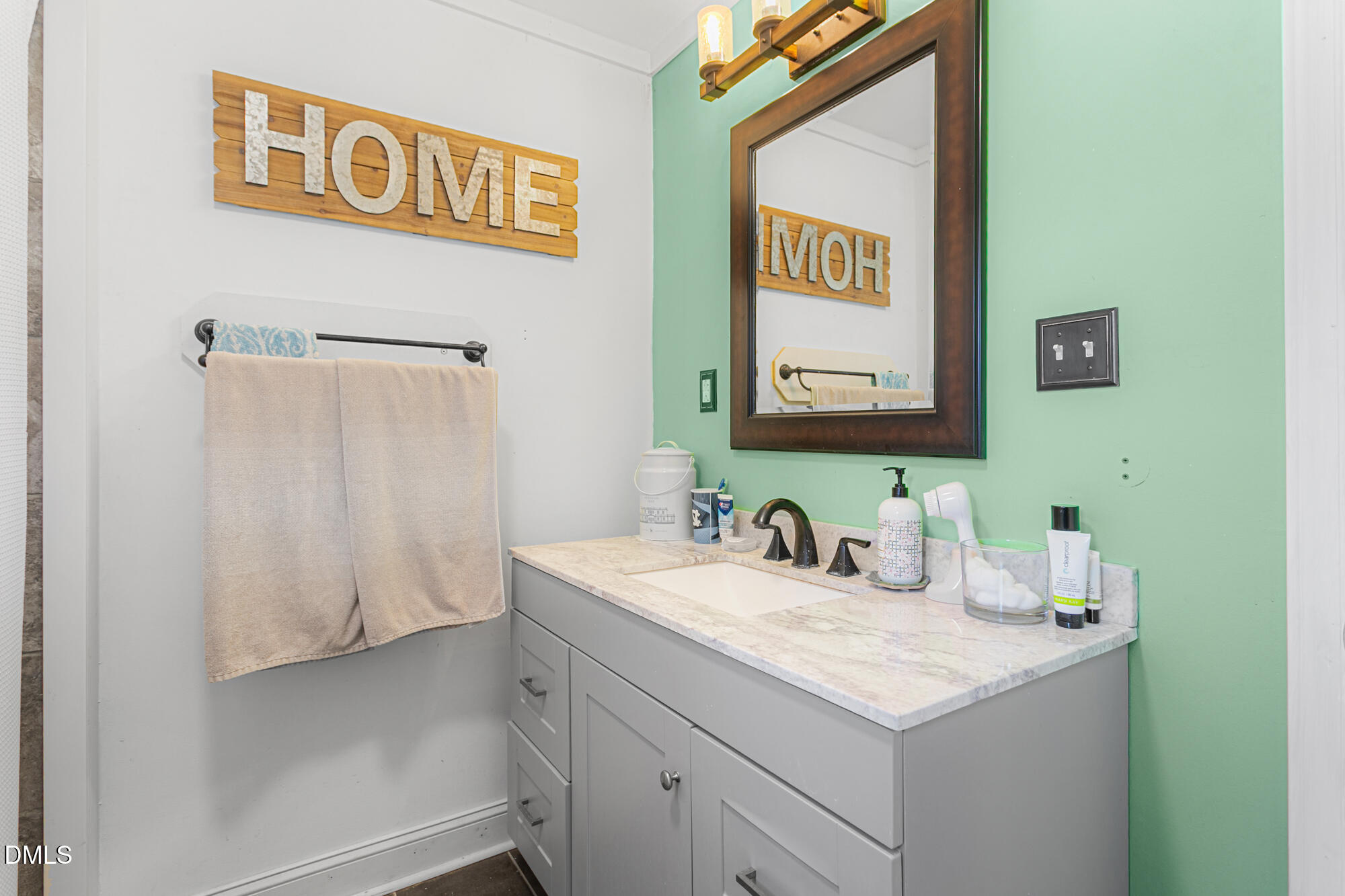 4244 Alamance Church Road Liberty, NC 27298 - Photo 17 of 37 a bathroom with a sink and a mirror