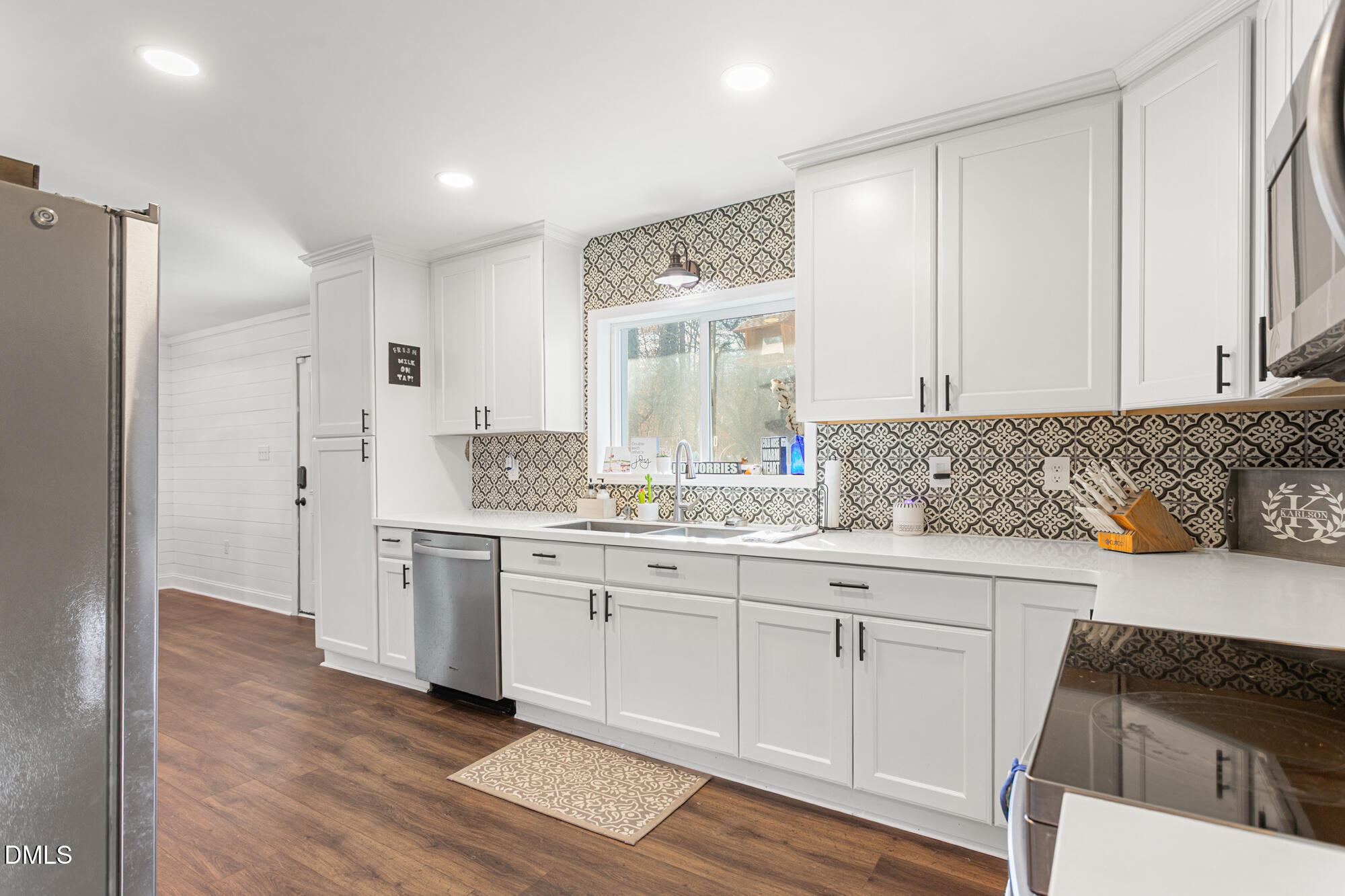 4244 Alamance Church Road Liberty, NC 27298 - Photo 7 of 37 a spacious bathroom with a granite countertop sink and a mirror