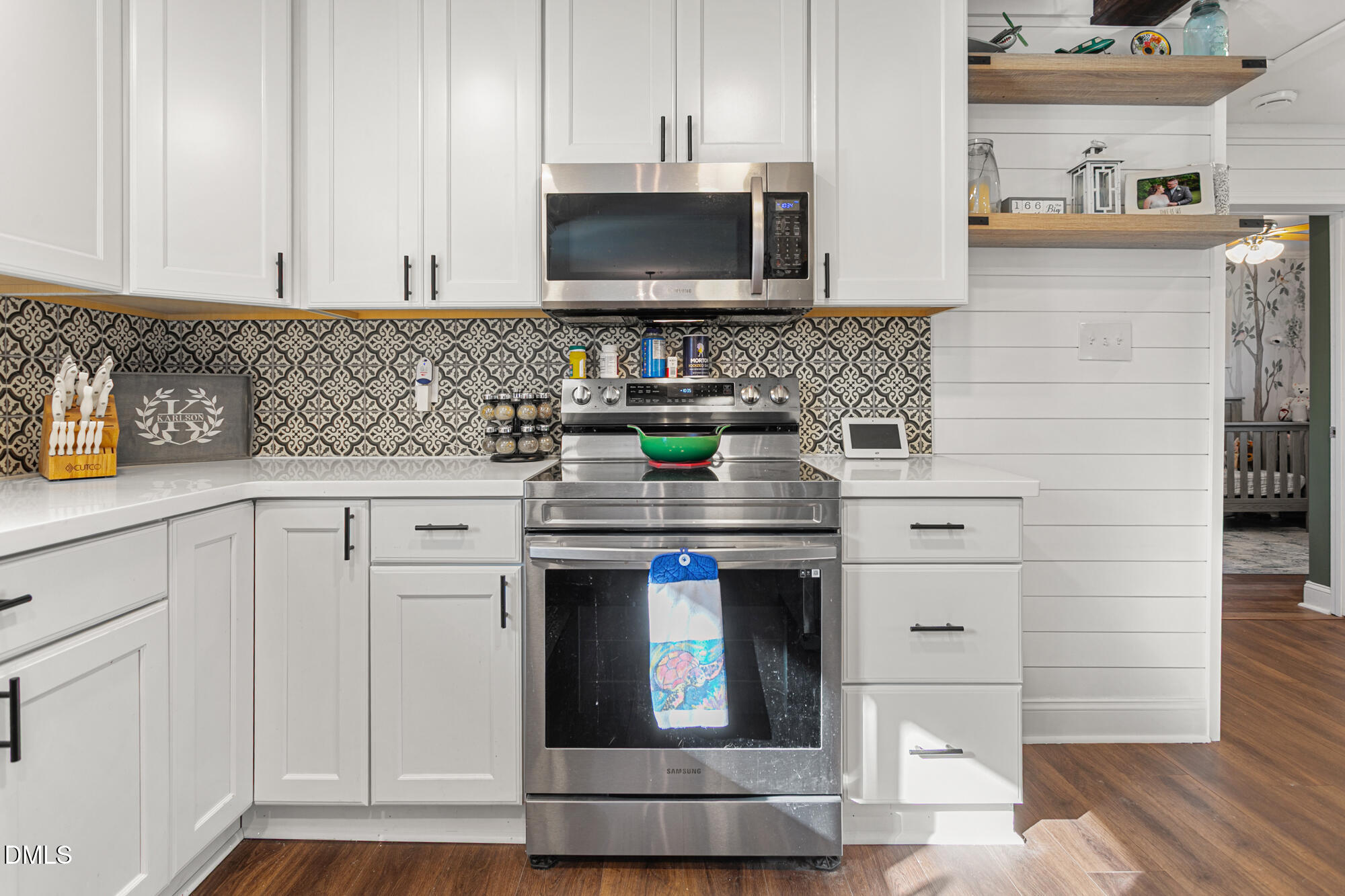 4244 Alamance Church Road Liberty, NC 27298 - Photo 9 of 37 a kitchen with stainless steel appliances granite countertop a stove and a microwave