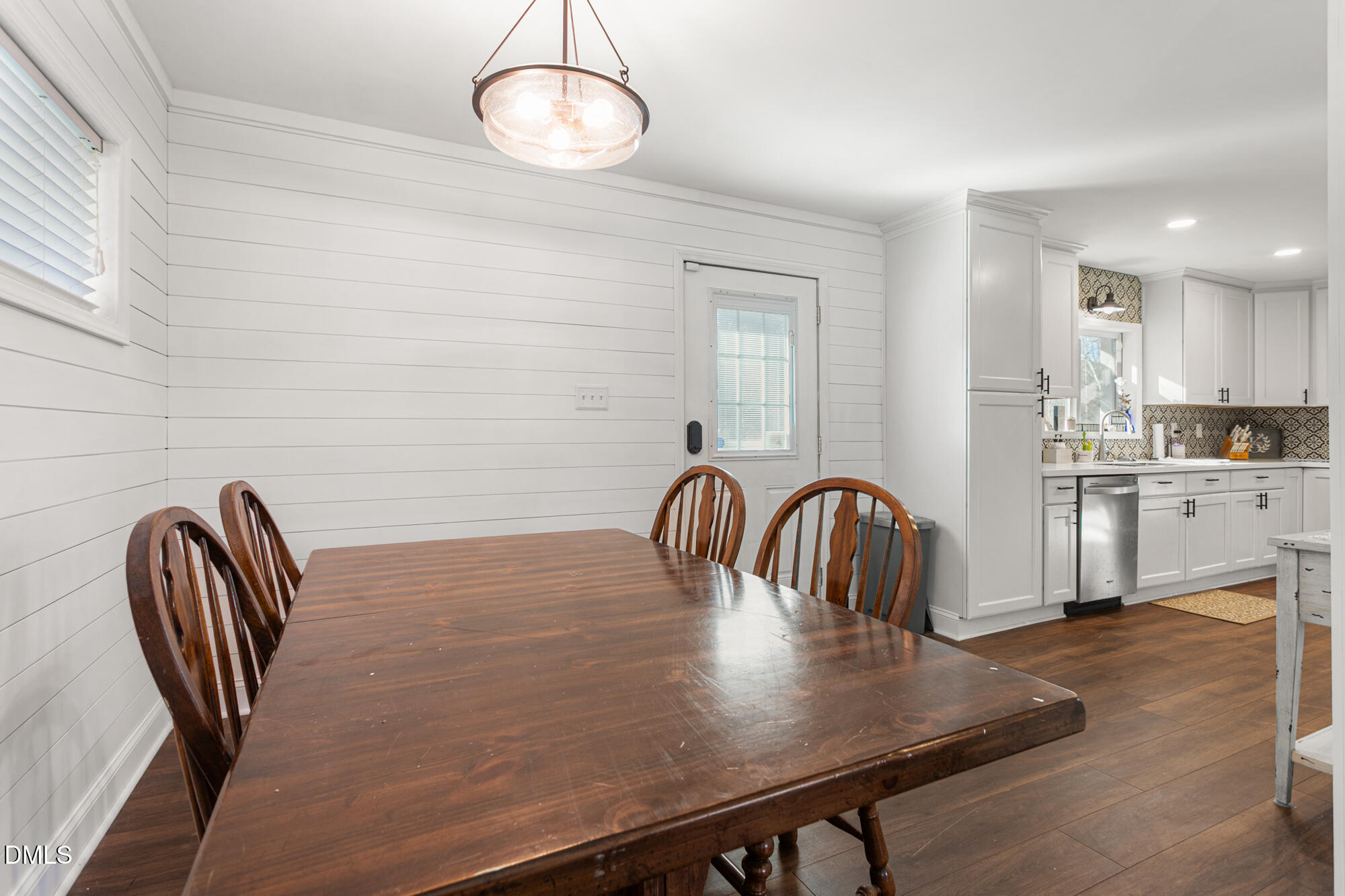 4244 Alamance Church Road Liberty, NC 27298 - Photo 10 of 37 a kitchen with a table chairs and a microwave