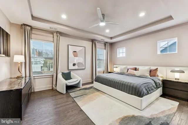 a spacious bedroom with a large bed and a couch