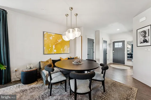 a dining room with furniture and window