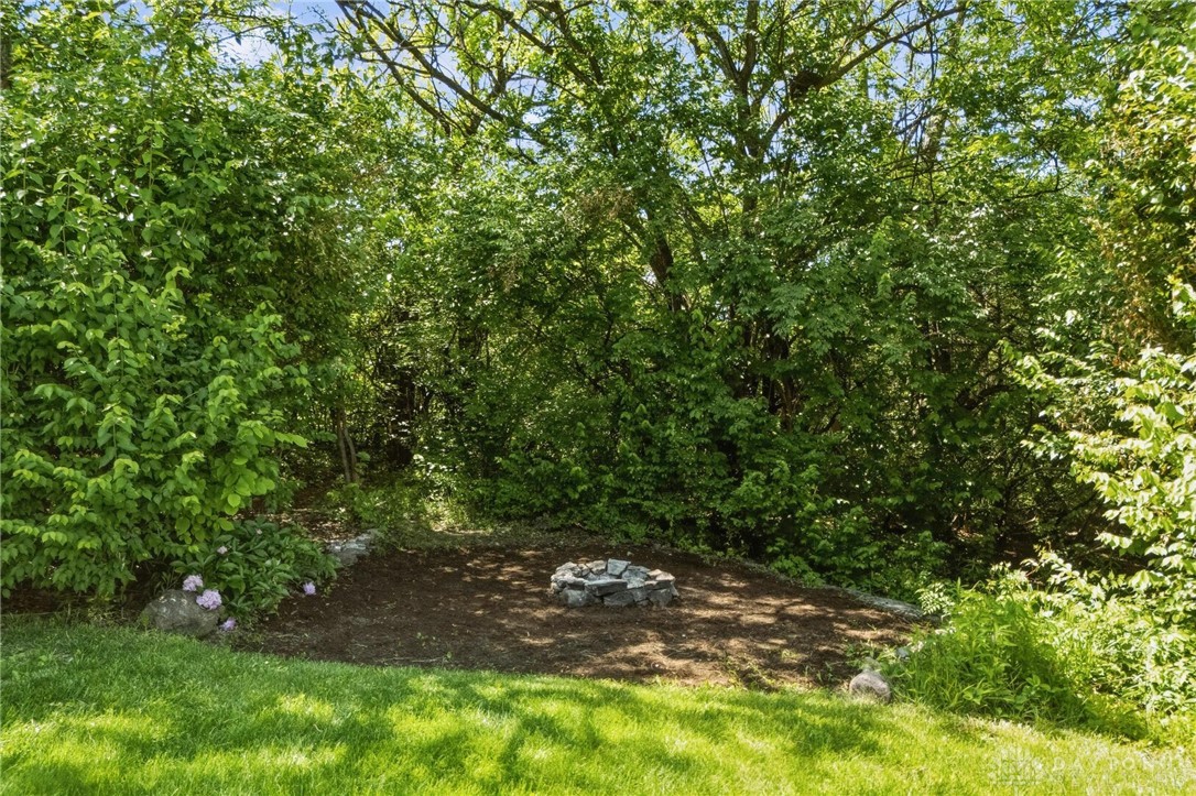 70 Martin Lane Springboro, OH 45066 - Photo 56 of 69 This serene outdoor space offers a natural retreat, perfect for relaxation and gatherings.