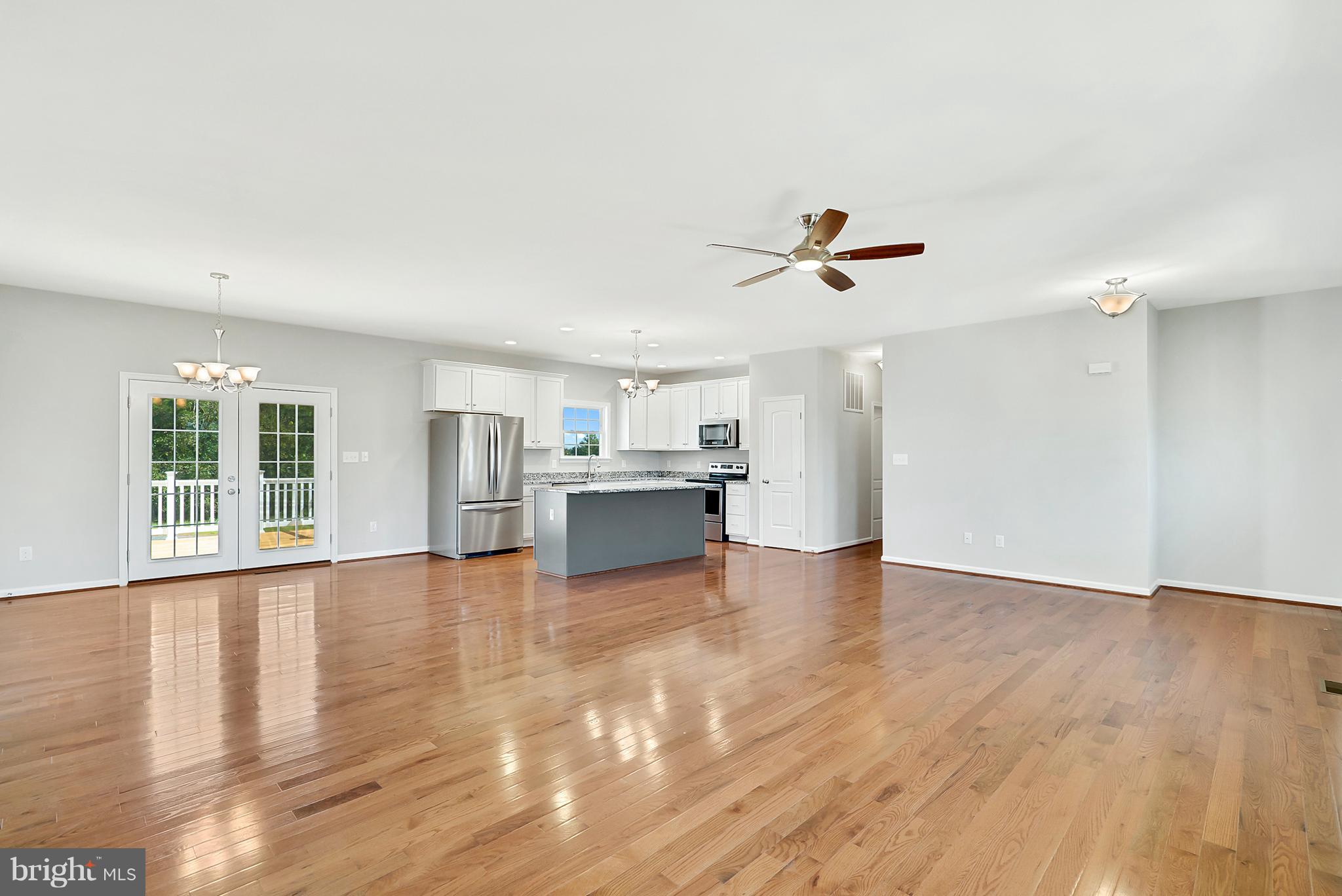 1614 Jonas Road Culpeper, VA 22701 - Photo 7 of 20 Family Room to kitchen - upgraded kitchen shown