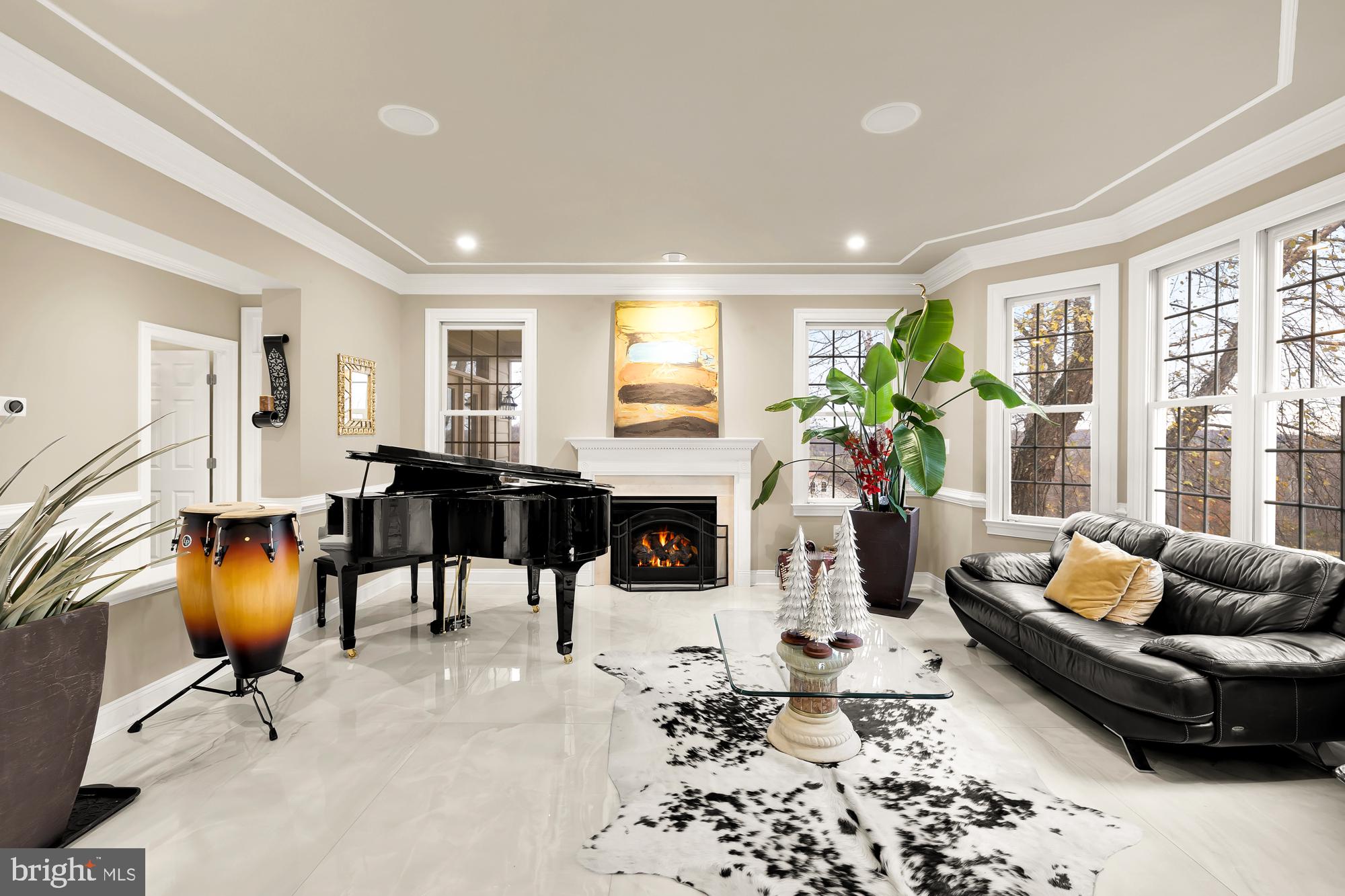 19109 Peale Lane Leesburg, VA 20175 - Photo 11 of 135 a living room with furniture a fireplace and a table