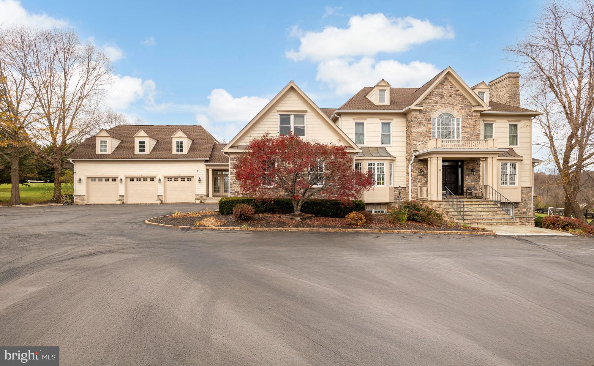 19109 Peale Lane Leesburg, VA 20175 - Photo 135 of 135 a front view of a house with a yard and garage