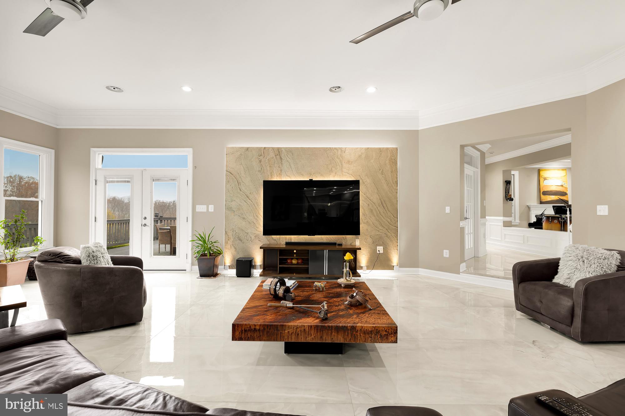 19109 Peale Lane Leesburg, VA 20175 - Photo 15 of 135 a living room with furniture and a flat screen tv