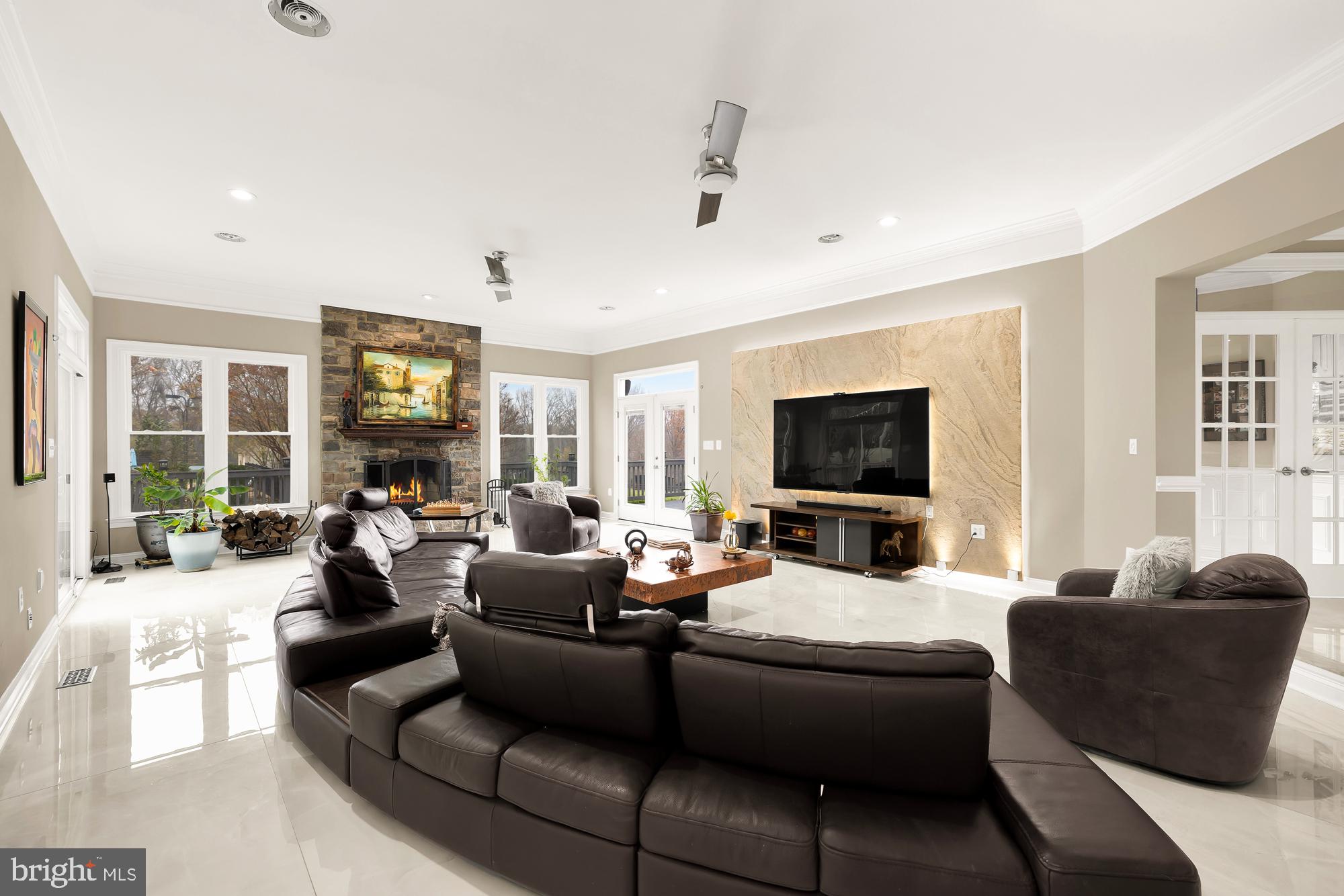 19109 Peale Lane Leesburg, VA 20175 - Photo 19 of 135 a living room with furniture flat screen tv and a fireplace