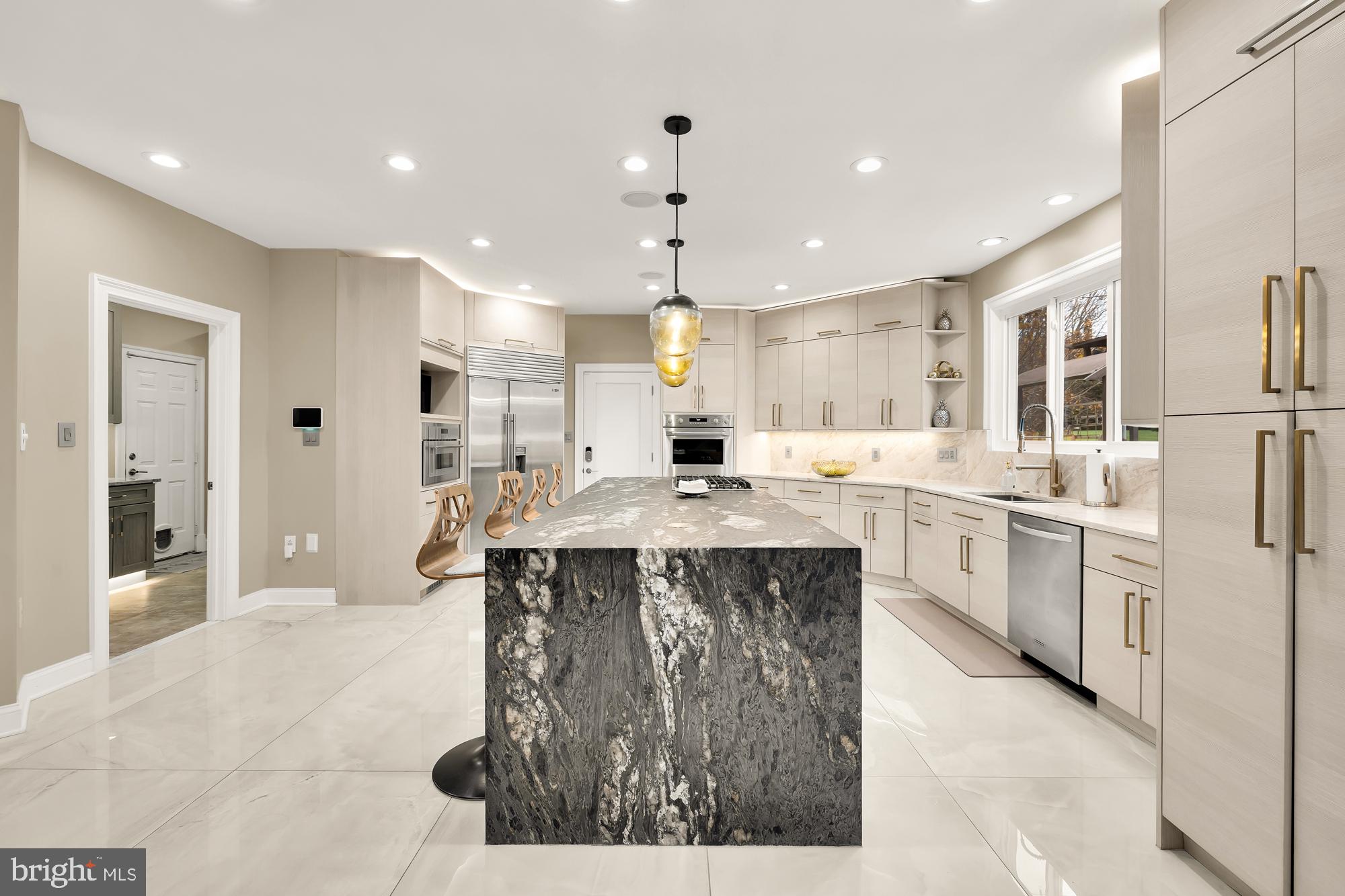 19109 Peale Lane Leesburg, VA 20175 - Photo 28 of 135 a large kitchen with kitchen island a sink stainless steel appliances and cabinets