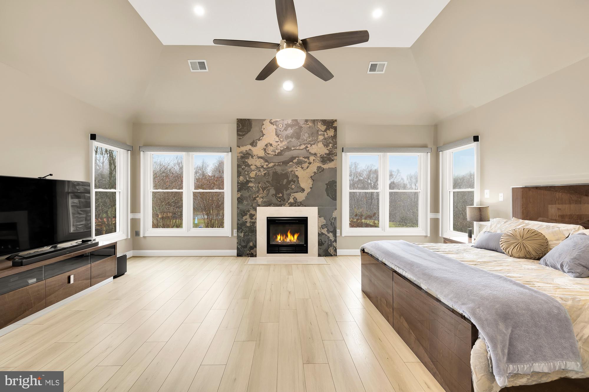 19109 Peale Lane Leesburg, VA 20175 - Photo 43 of 135 a spacious bedroom with a large bed and a flat screen tv