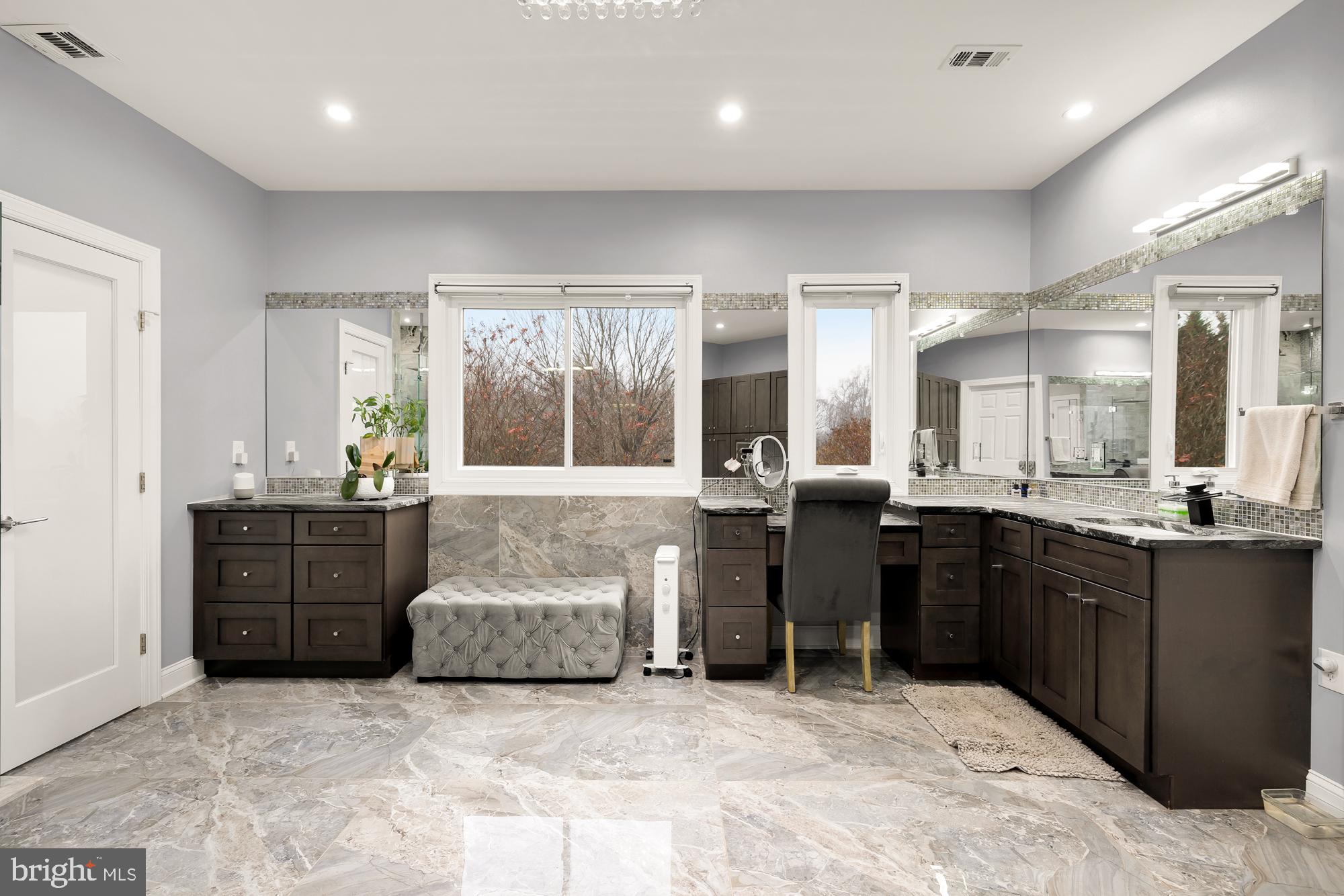 19109 Peale Lane Leesburg, VA 20175 - Photo 52 of 135 a large bathroom with a large tub sink and cabinets
