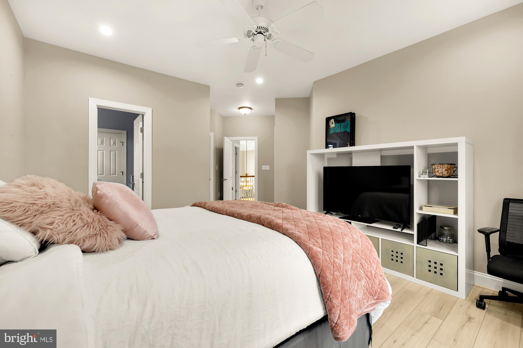 19109 Peale Lane Leesburg, VA 20175 - Photo 57 of 135 a bedroom with a bed and a flat screen tv