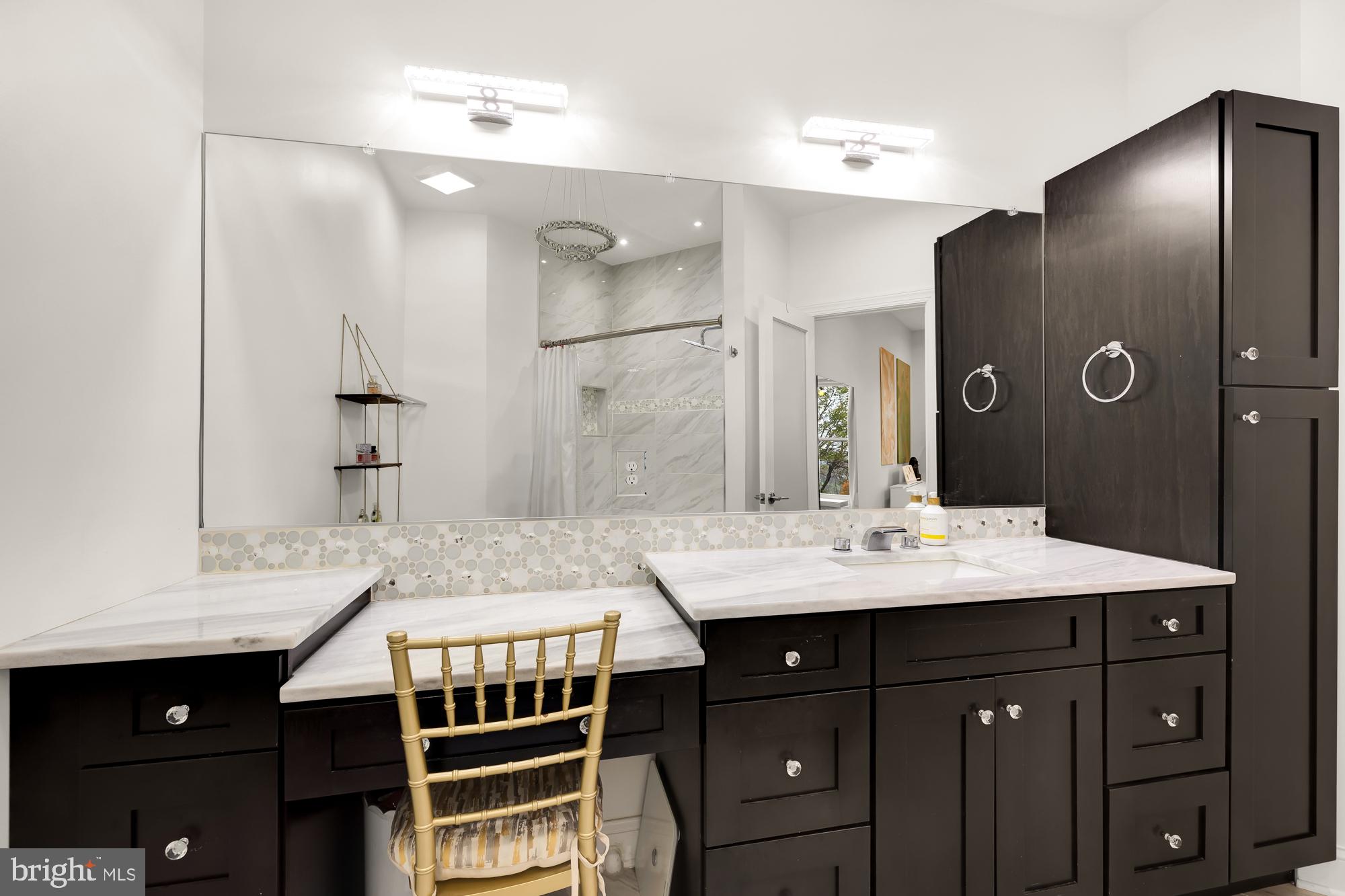 19109 Peale Lane Leesburg, VA 20175 - Photo 67 of 135 a spacious bathroom with a granite countertop sink a mirror and a shower
