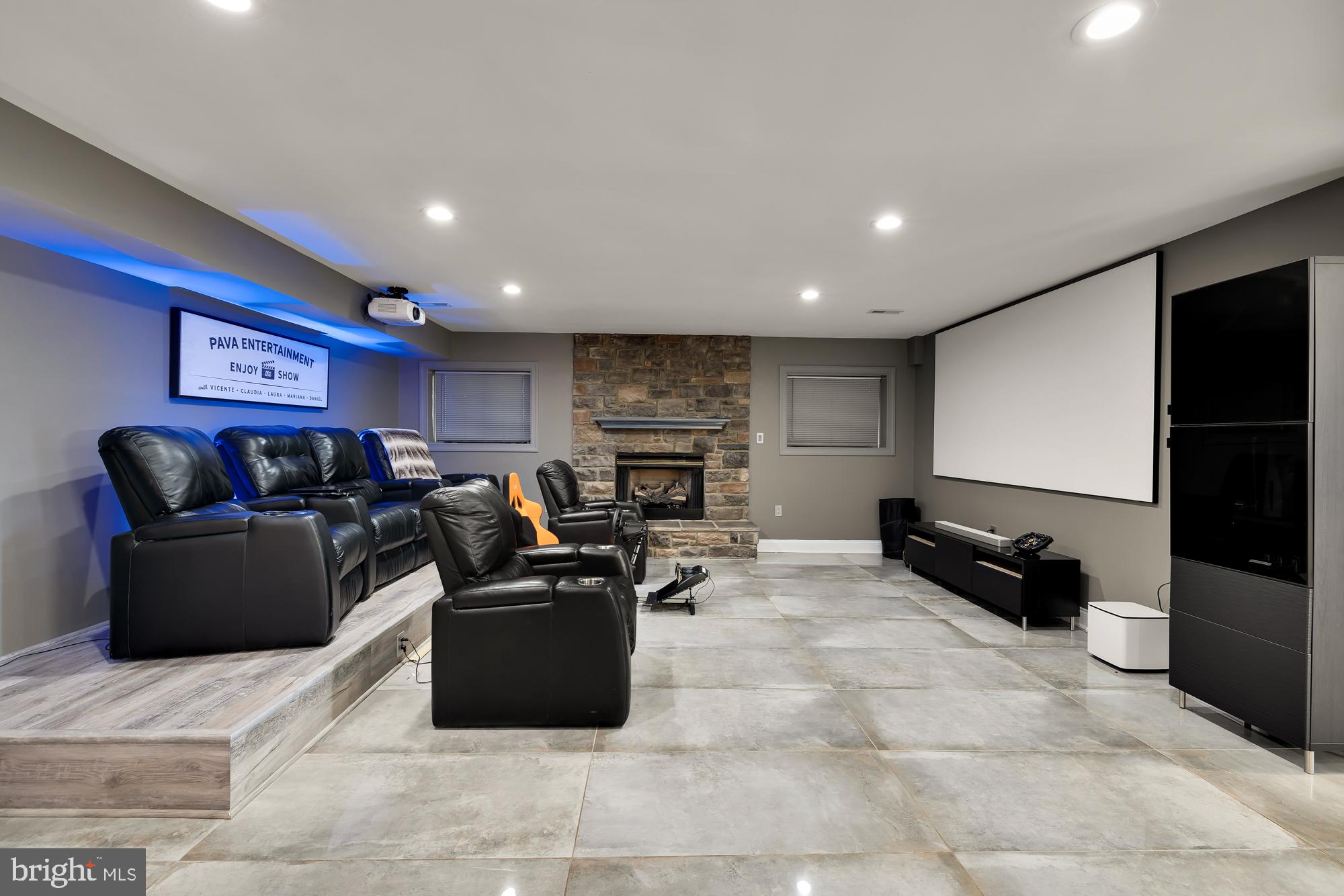 19109 Peale Lane Leesburg, VA 20175 - Photo 85 of 135 a living room with furniture a flat screen tv and a refrigerator