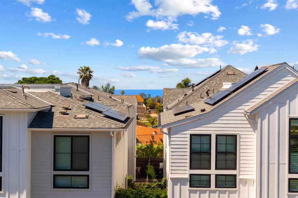 1602 San Remo Place, Unit 201 Encinitas, CA 92024 - Photo 18 of 56 a view of a house with a yard