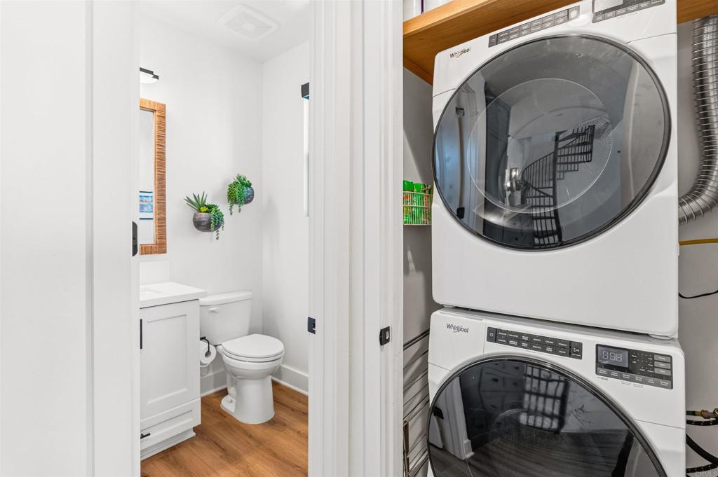 1602 San Remo Place, Unit 201 Encinitas, CA 92024 - Photo 21 of 56 a view of washer and dryer in a bathroom
