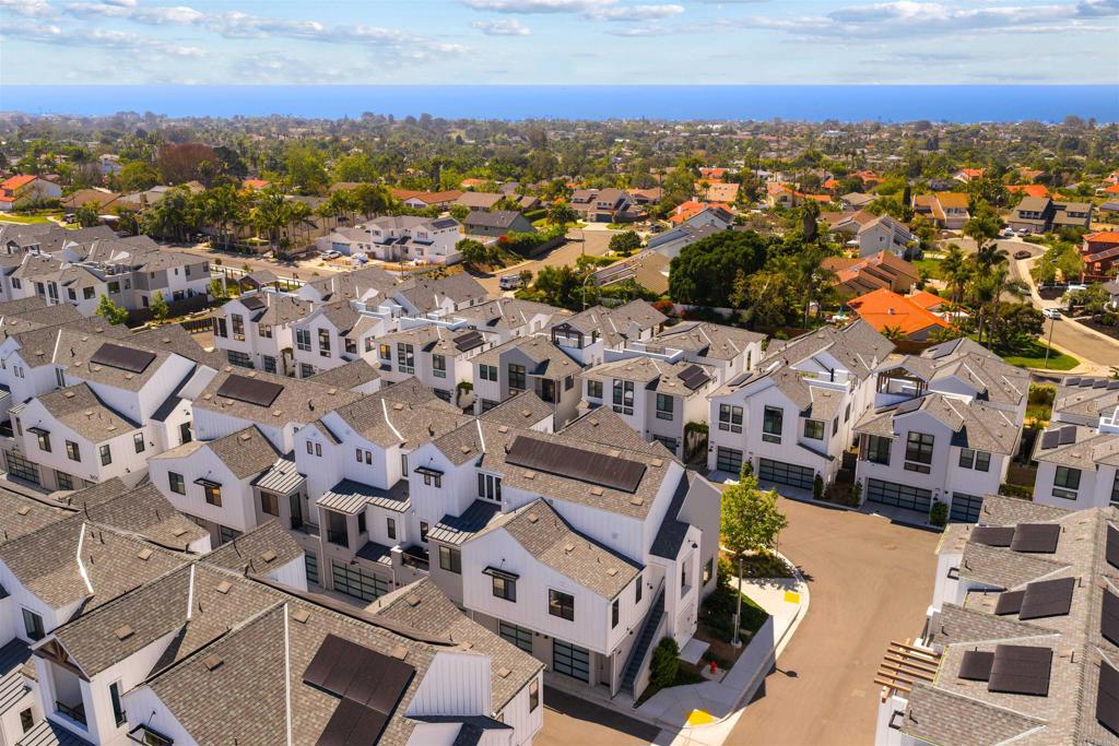 1602 San Remo Place, Unit 201 Encinitas, CA 92024 - Photo 45 of 56 an aerial view of residential building with parking