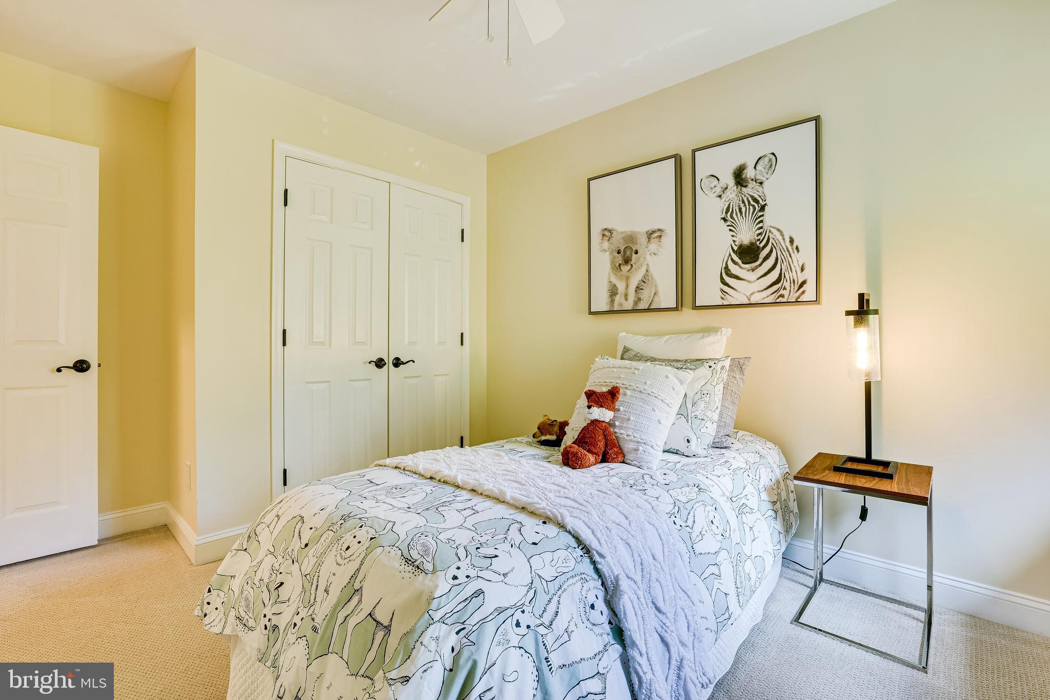 11056 Thrush Ridge Road Reston, VA 20191 - Photo 39 of 62 a bedroom with a bed and a painting on the wall