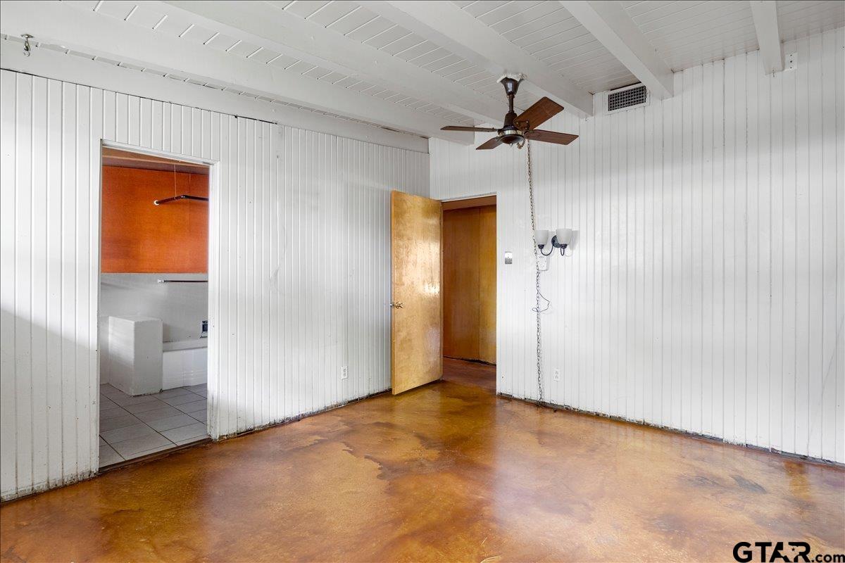 904 East Dulse Street Tyler, TX 75701 - Photo 12 of 27 a view of a room with a ceiling fan and closet area