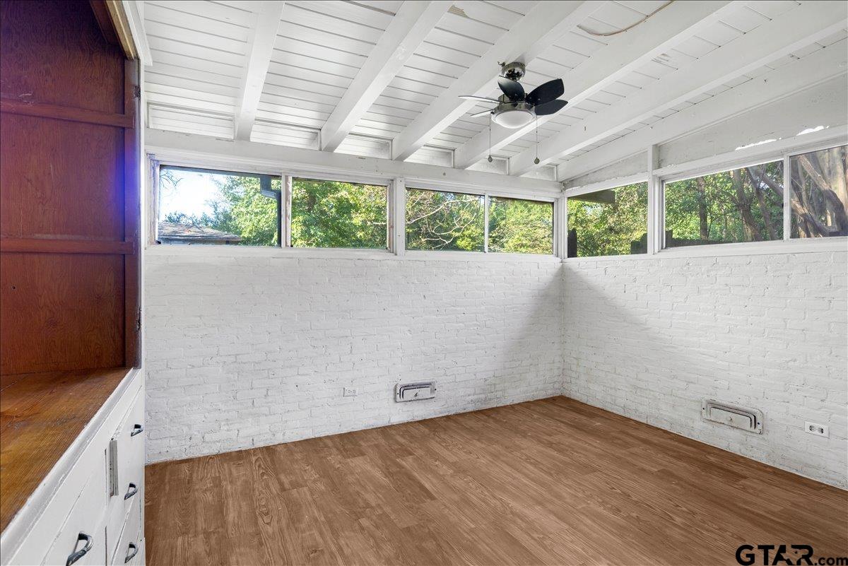 904 East Dulse Street Tyler, TX 75701 - Photo 17 of 27 an empty room with wooden floor and windows