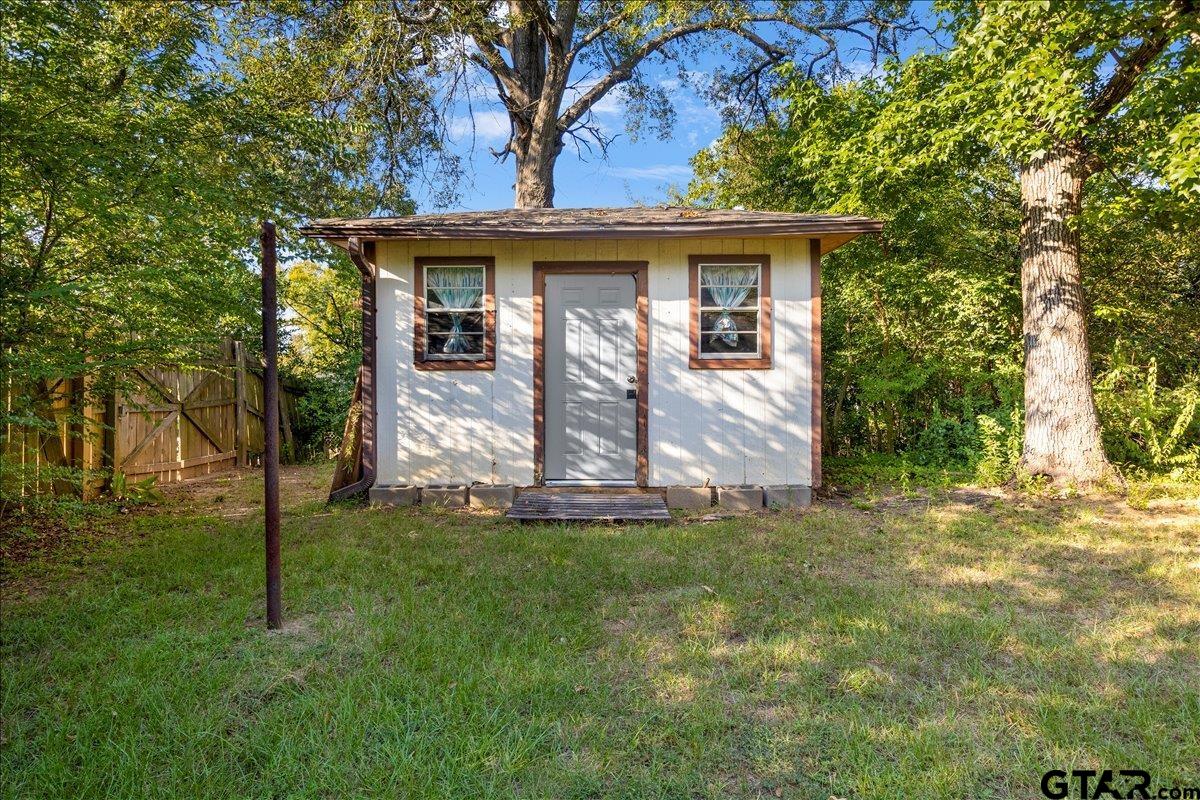 904 East Dulse Street Tyler, TX 75701 - Photo 24 of 27 a front view of a house with a garden