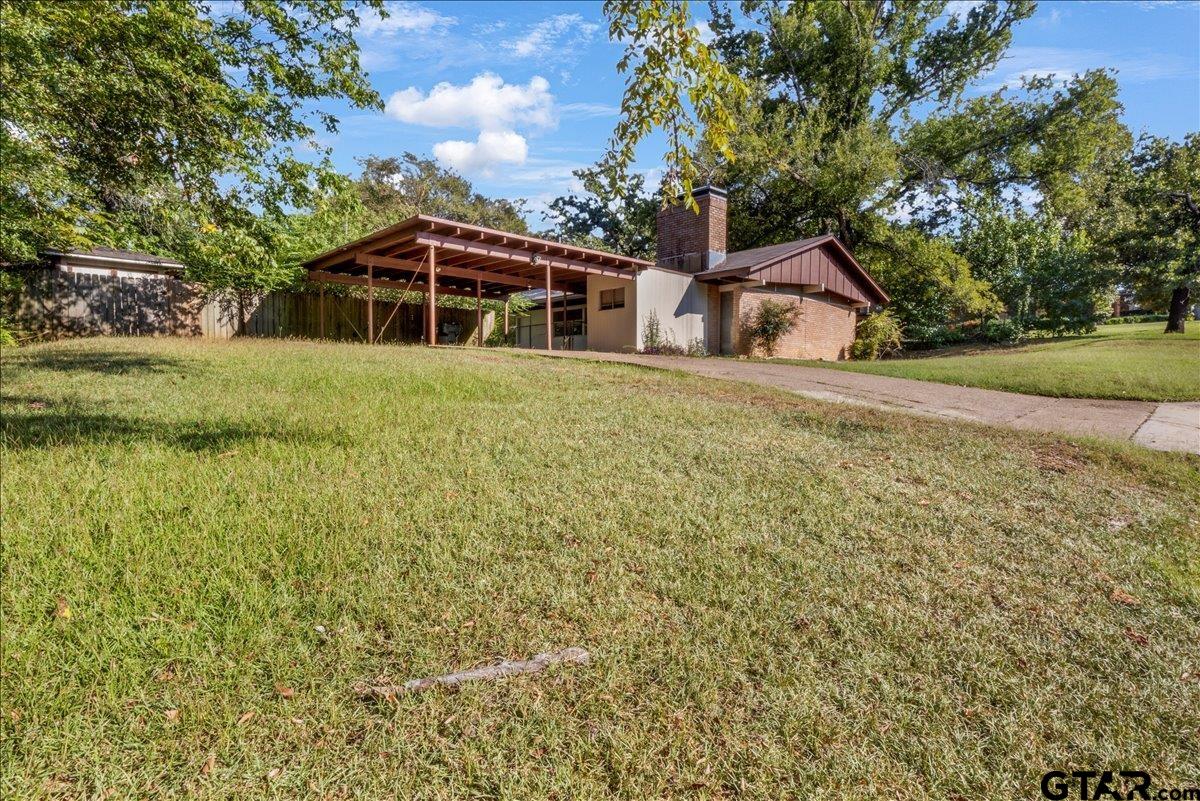 904 East Dulse Street Tyler, TX 75701 - Photo 4 of 27 a front view of a house with a yard