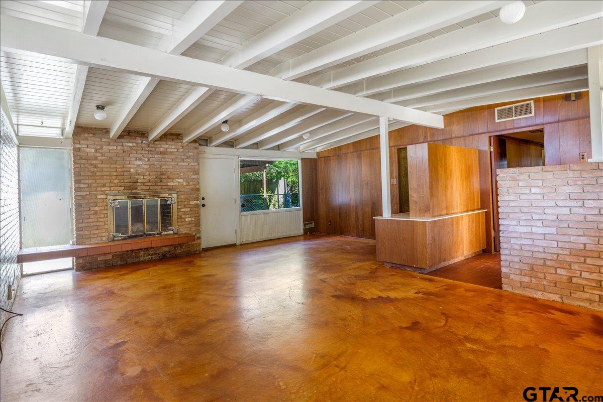 904 East Dulse Street Tyler, TX 75701 - Photo 5 of 27 a view of empty room with wooden floor and fan
