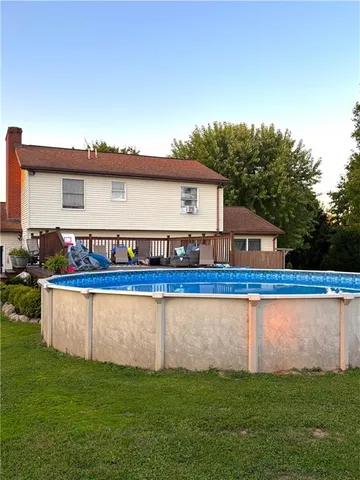 a view of a house with a backyard