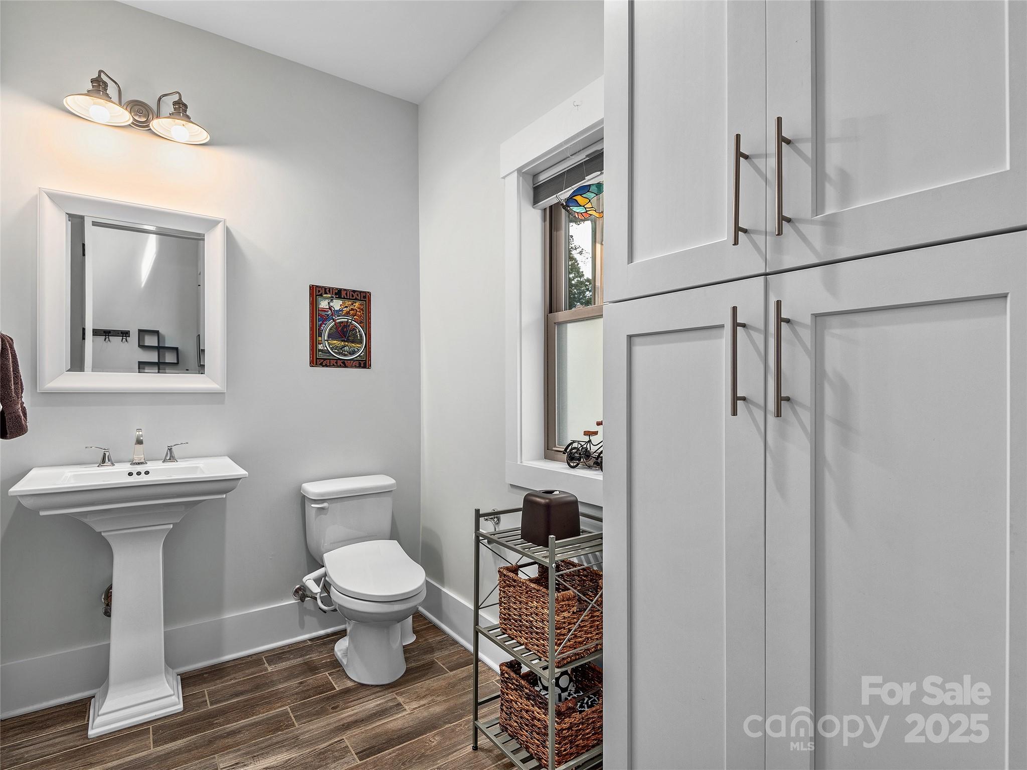 108 Enthoffer Road Black Mountain, NC 28711 - Photo 11 of 31 a bathroom with a toilet a sink and mirror