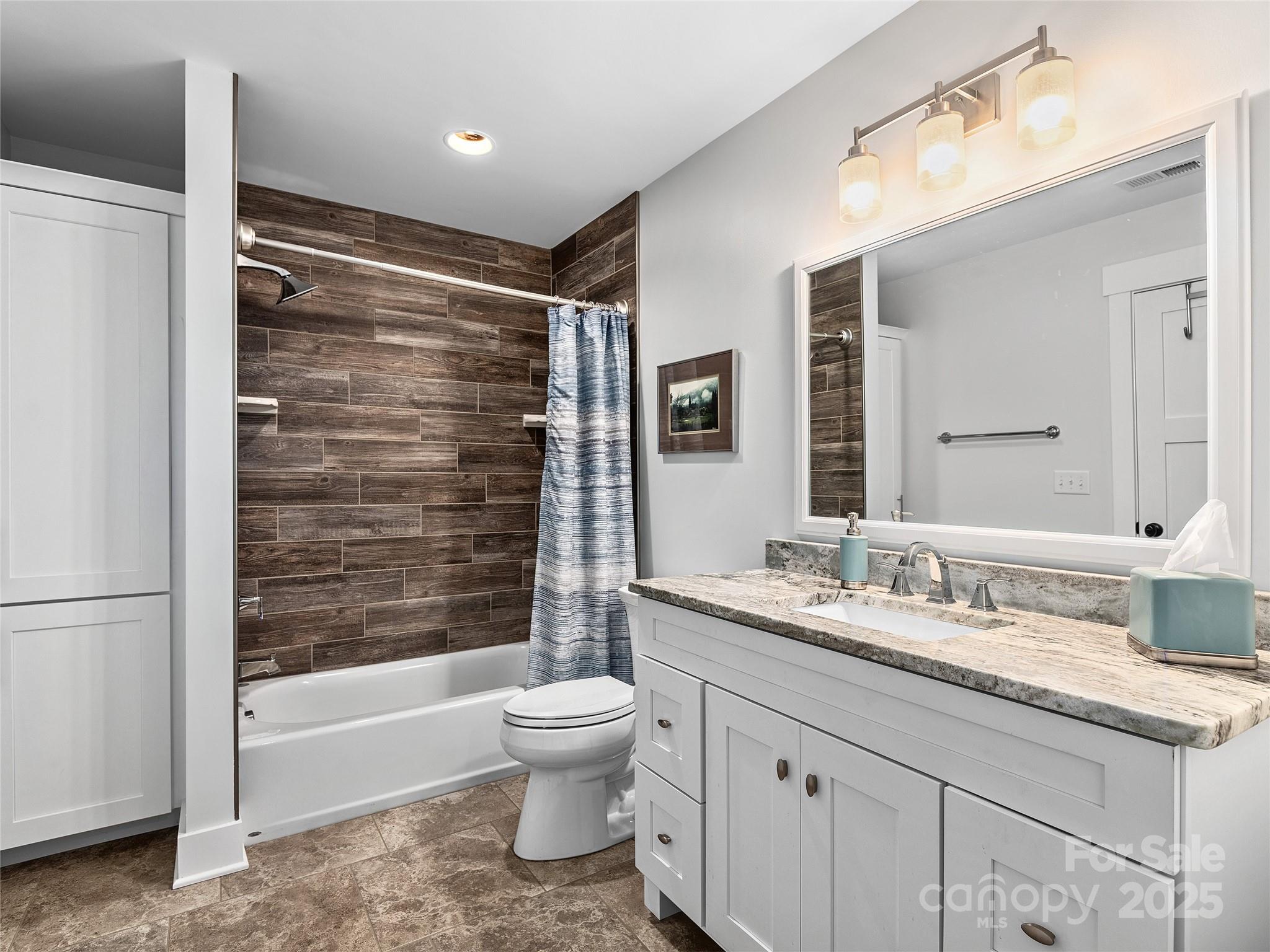 108 Enthoffer Road Black Mountain, NC 28711 - Photo 18 of 31 a bathroom with a granite countertop sink toilet and shower