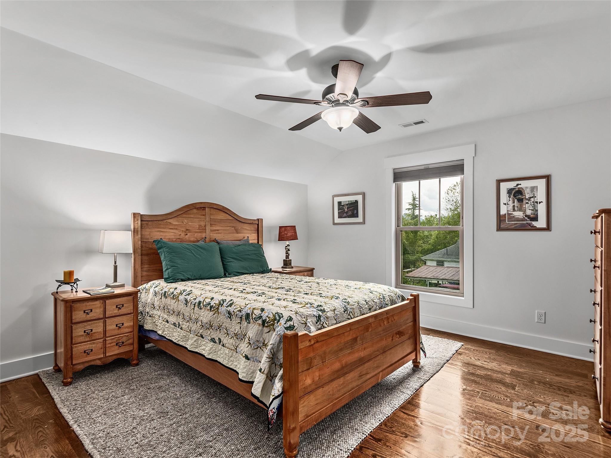 108 Enthoffer Road Black Mountain, NC 28711 - Photo 19 of 31 a bedroom with a bed chandelier and a window