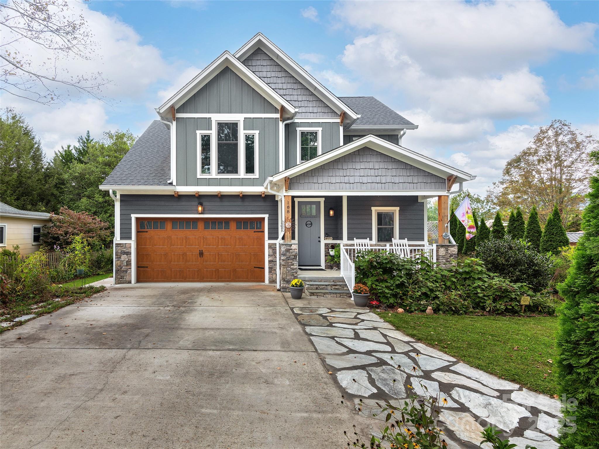 108 Enthoffer Road Black Mountain, NC 28711 - Photo 2 of 31 a front view of a house with a garden and yard