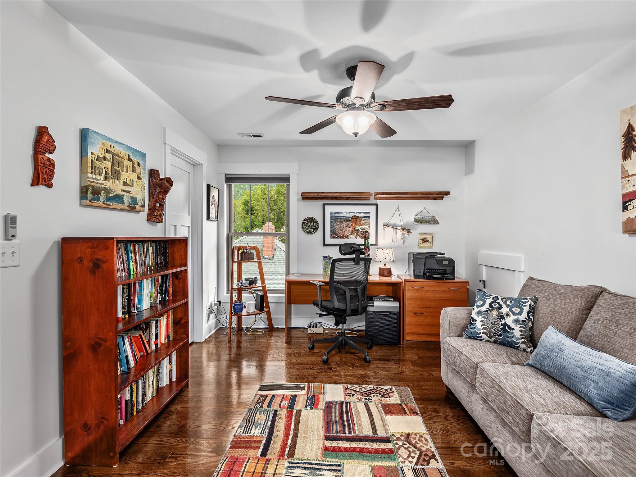 108 Enthoffer Road Black Mountain, NC 28711 - Photo 21 of 31 a living room with furniture a bookshelf and a window
