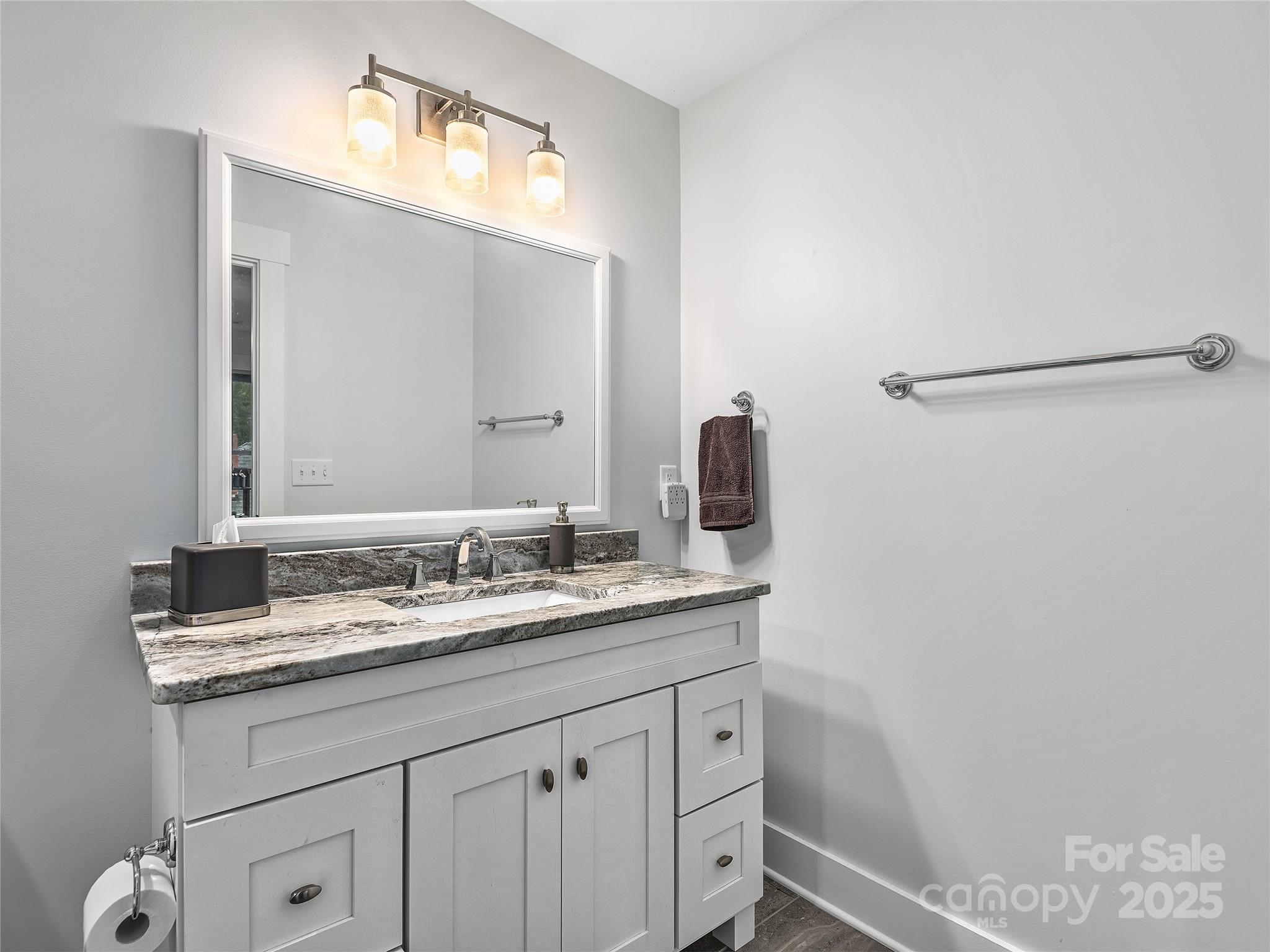 108 Enthoffer Road Black Mountain, NC 28711 - Photo 22 of 31 a bathroom with a granite countertop sink and a mirror