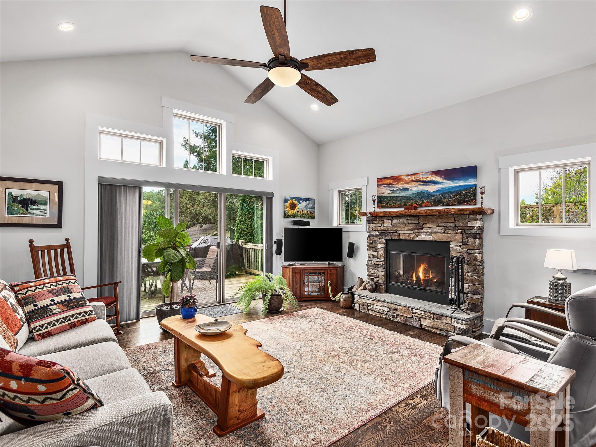 108 Enthoffer Road Black Mountain, NC 28711 - Photo 5 of 31 a living room with furniture a flat screen tv and a fireplace