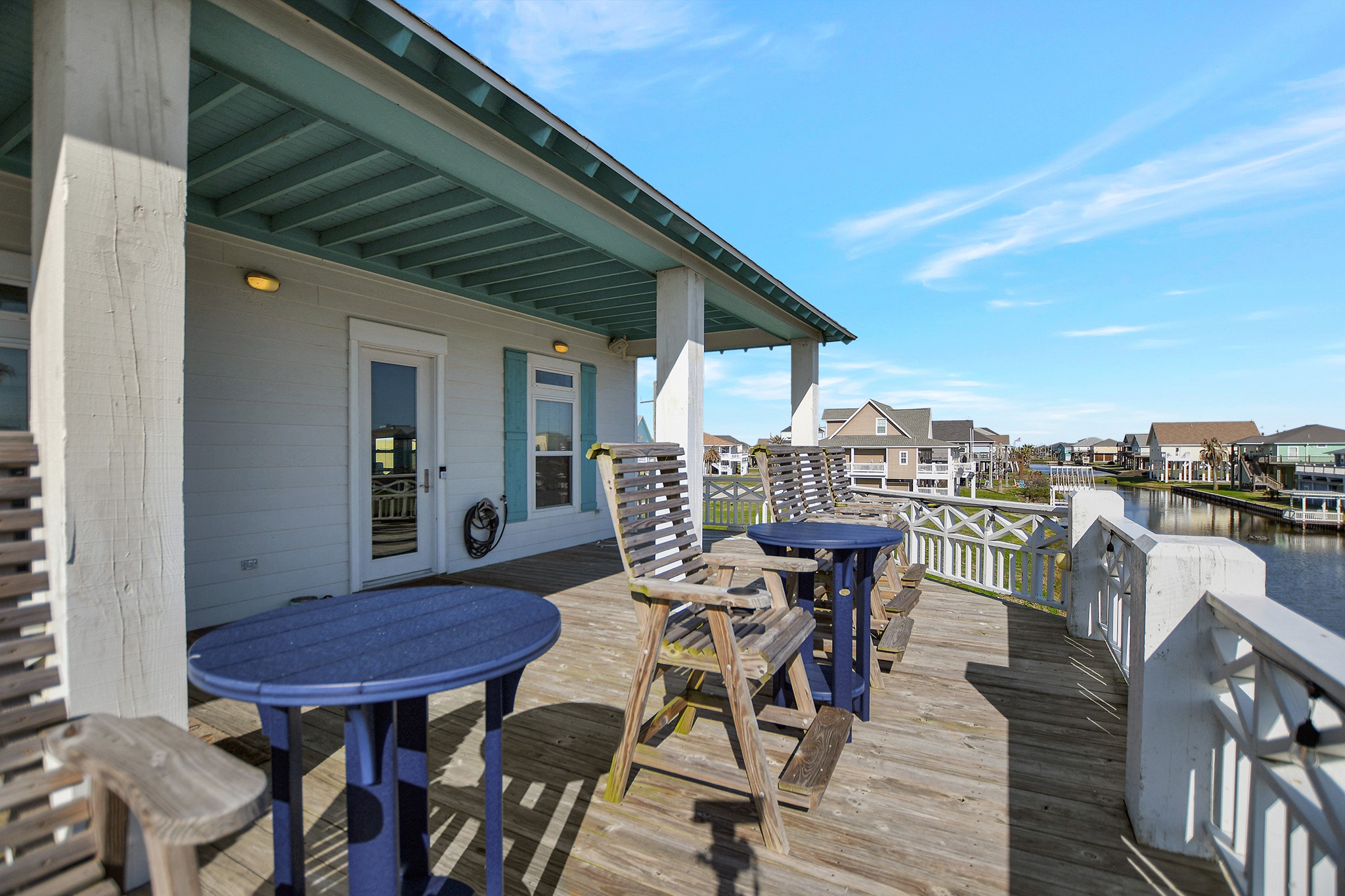 2570 Tide Road Port Bolivar, TX 77650 - Photo 13 of 50 a view of a chairs and table in patio with a barbeque