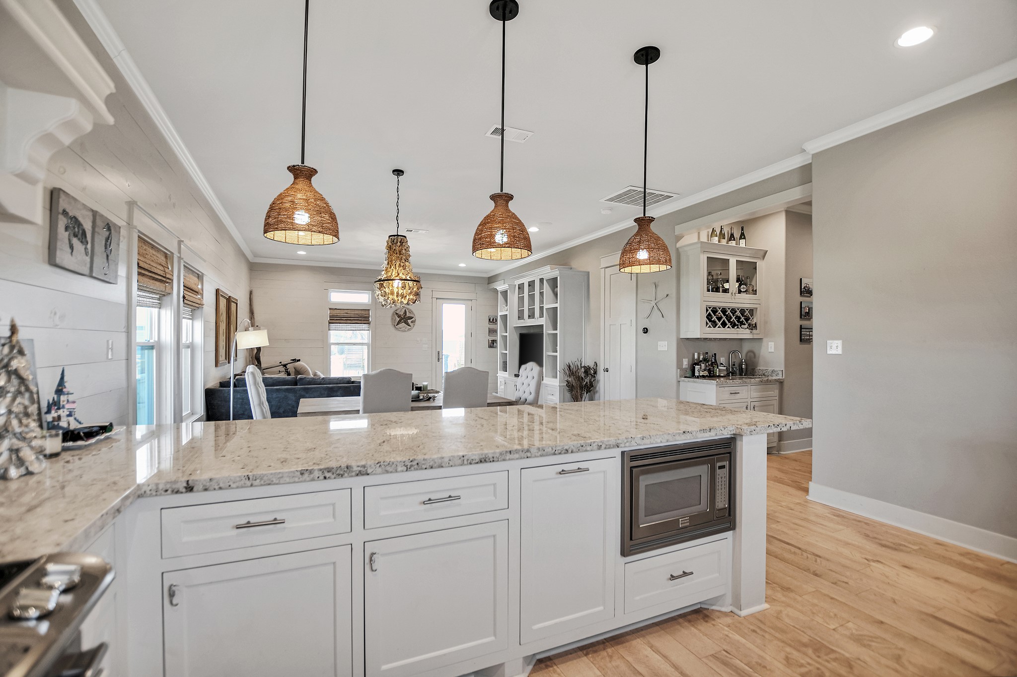 2570 Tide Road Port Bolivar, TX 77650 - Photo 26 of 50 a kitchen with stainless steel appliances granite countertop a sink a window and white cabinets